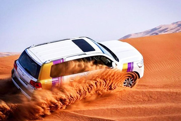 Experience the rush of sand beneath your wheels as you embark on an unforgettable adventure through the mesmerizing dunes of the Dubai desert where nature meets excitement.